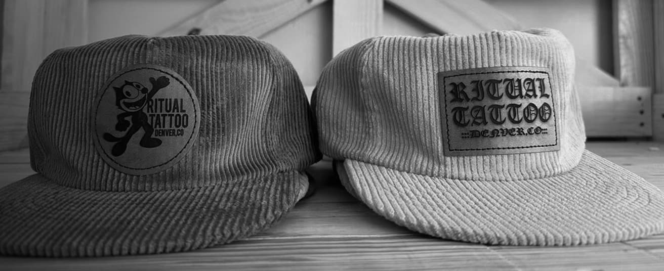 Two hats on a table.