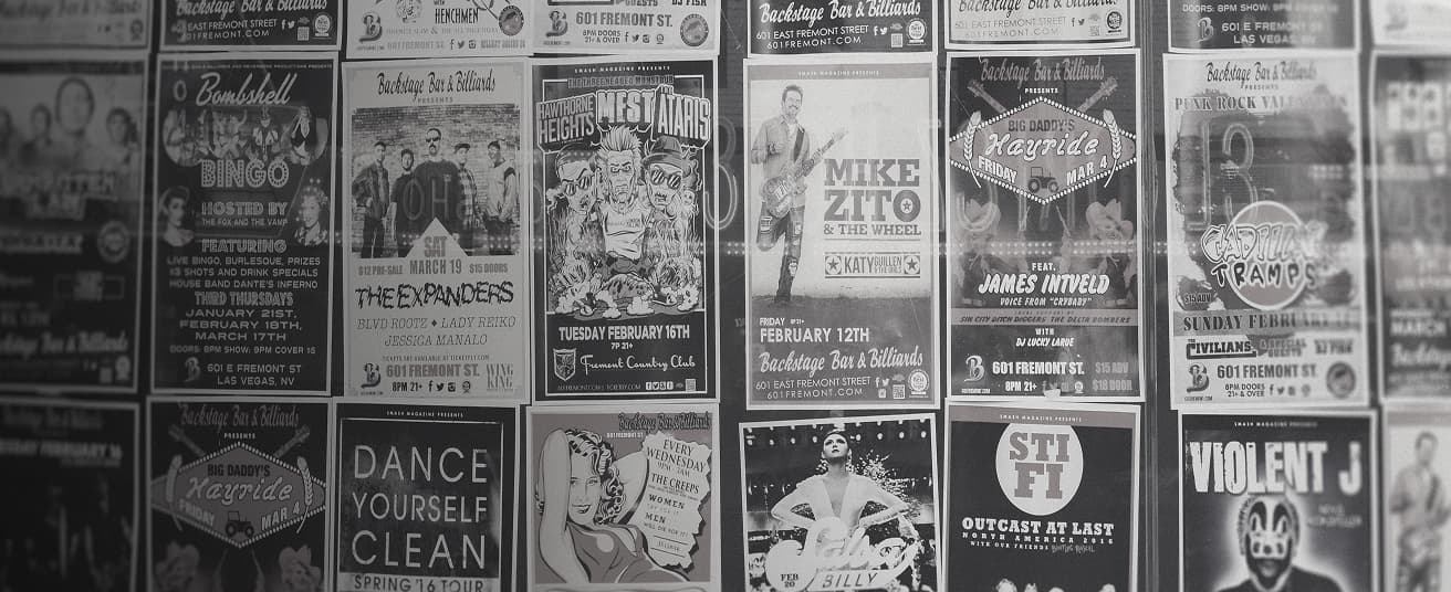 Design posters on a wall.
